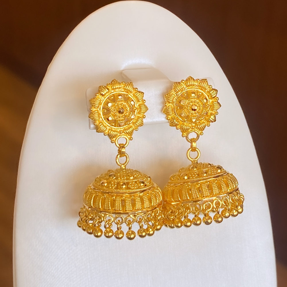 A pair of filigree gold drop earrings with beaded fringes on black